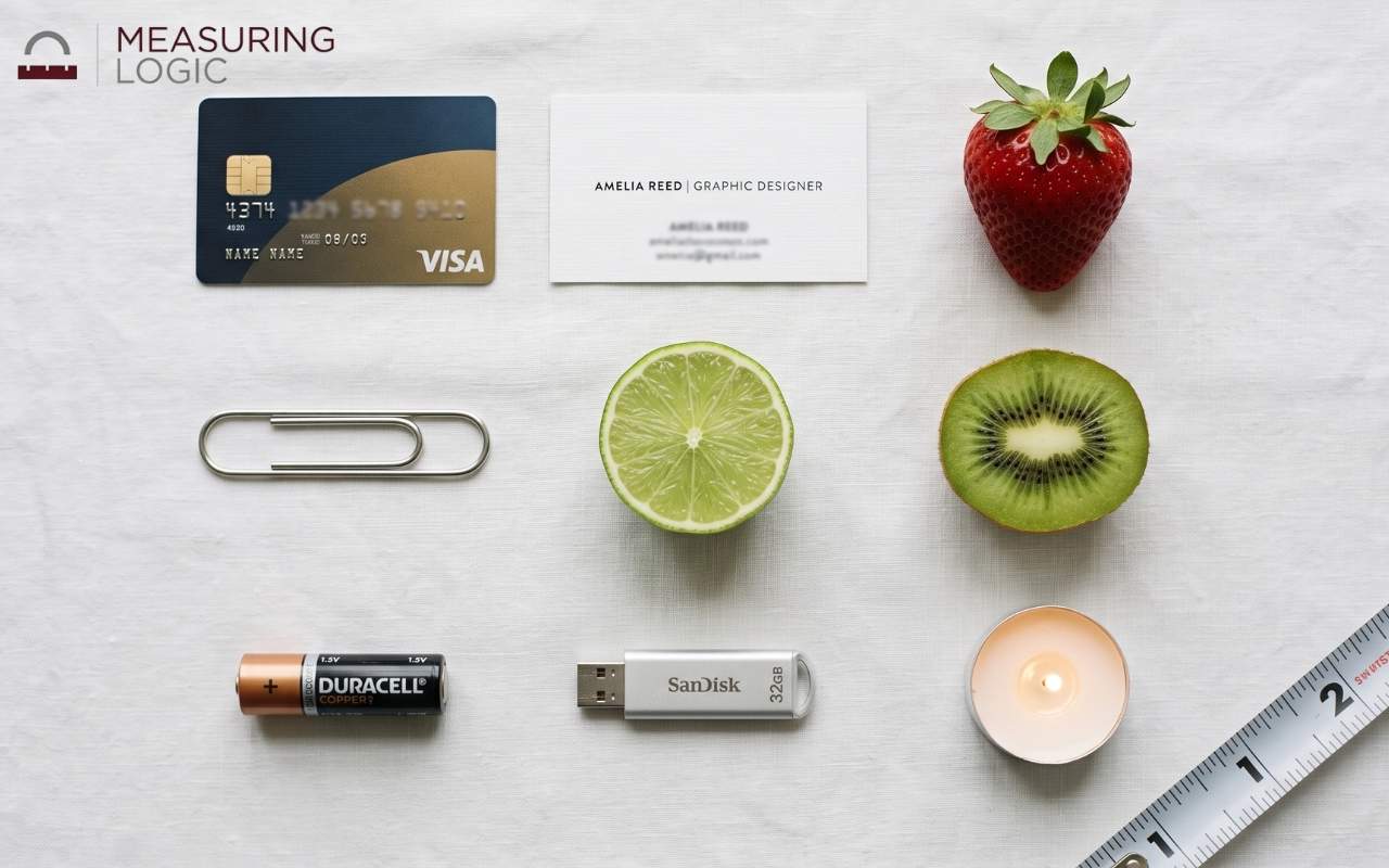 Grid of everyday objects and fruit beside a tape measure showing 2 inches for scale.