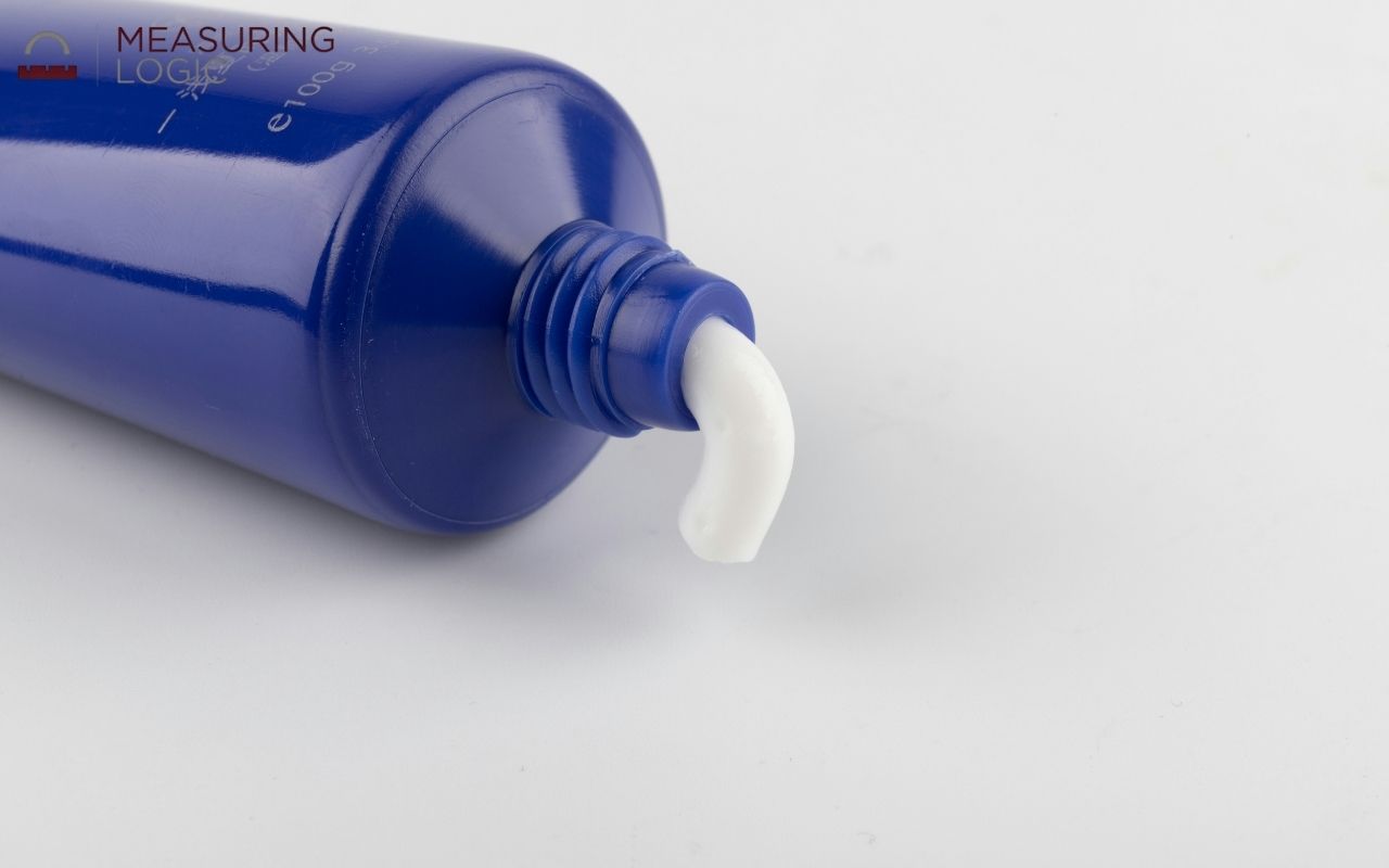 Travel-size toothpaste tube close up
