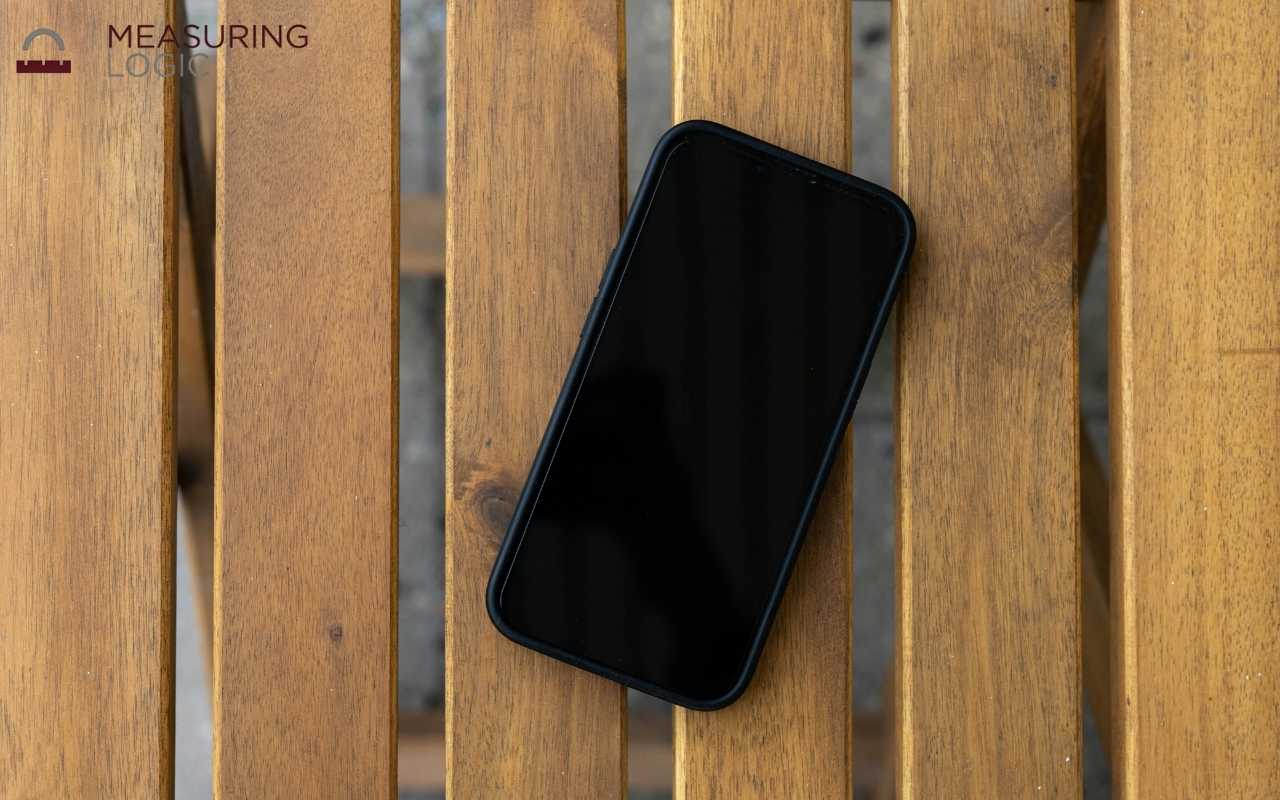 Smartphone lying flat showing a width close to 3 inches