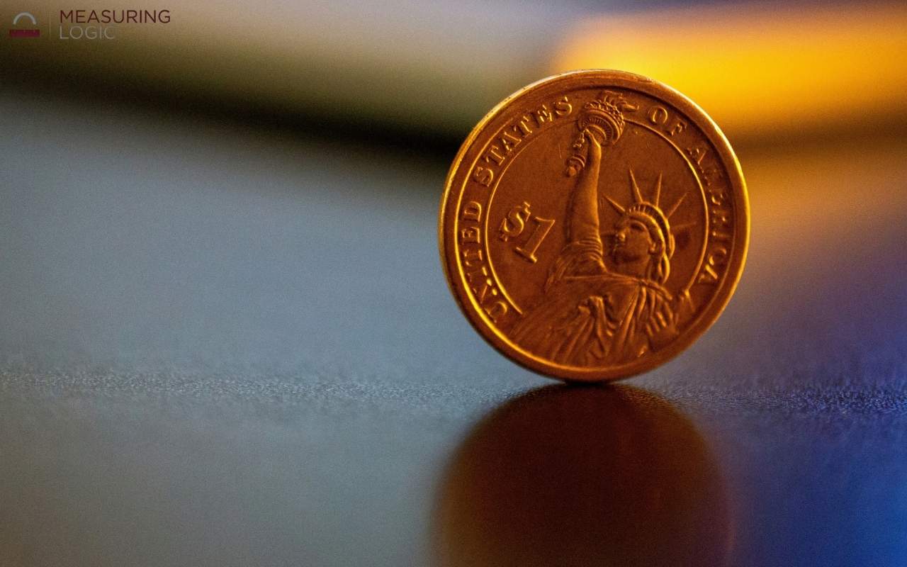 A U.S. dollar coin exactly 2mm thick