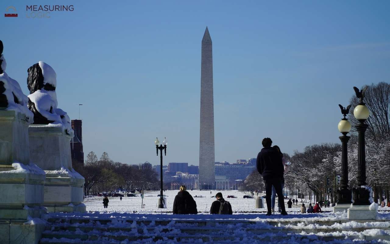 Washington Monument rising above a snowy landscape