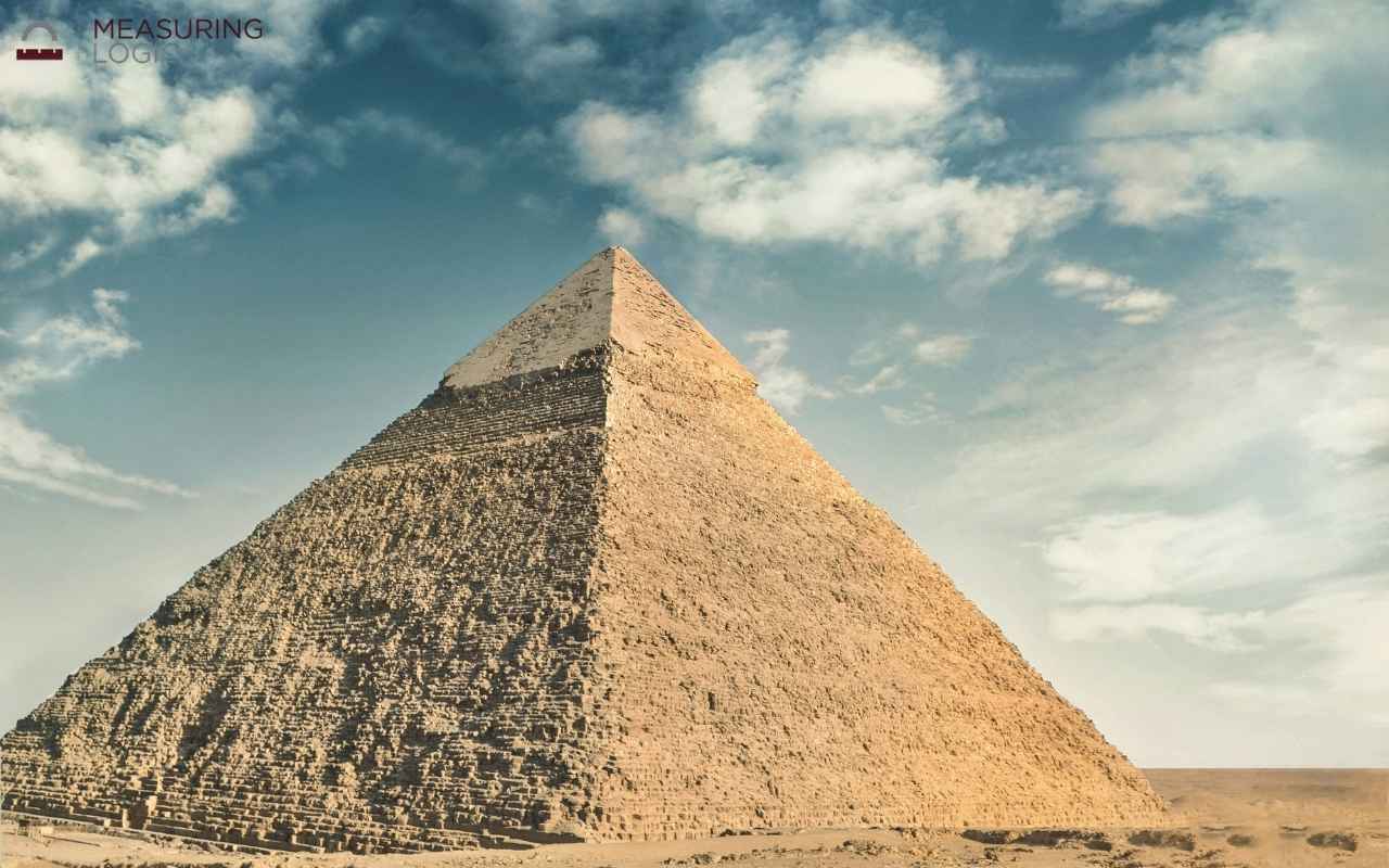Great Pyramid under a cloudy sky, representing a height near 500 feet